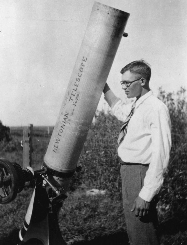 Clyde W. Tombaugh, circa 1930, with the homemade 9-inch reflecting telescope he built and used before joining Lowell Observatory