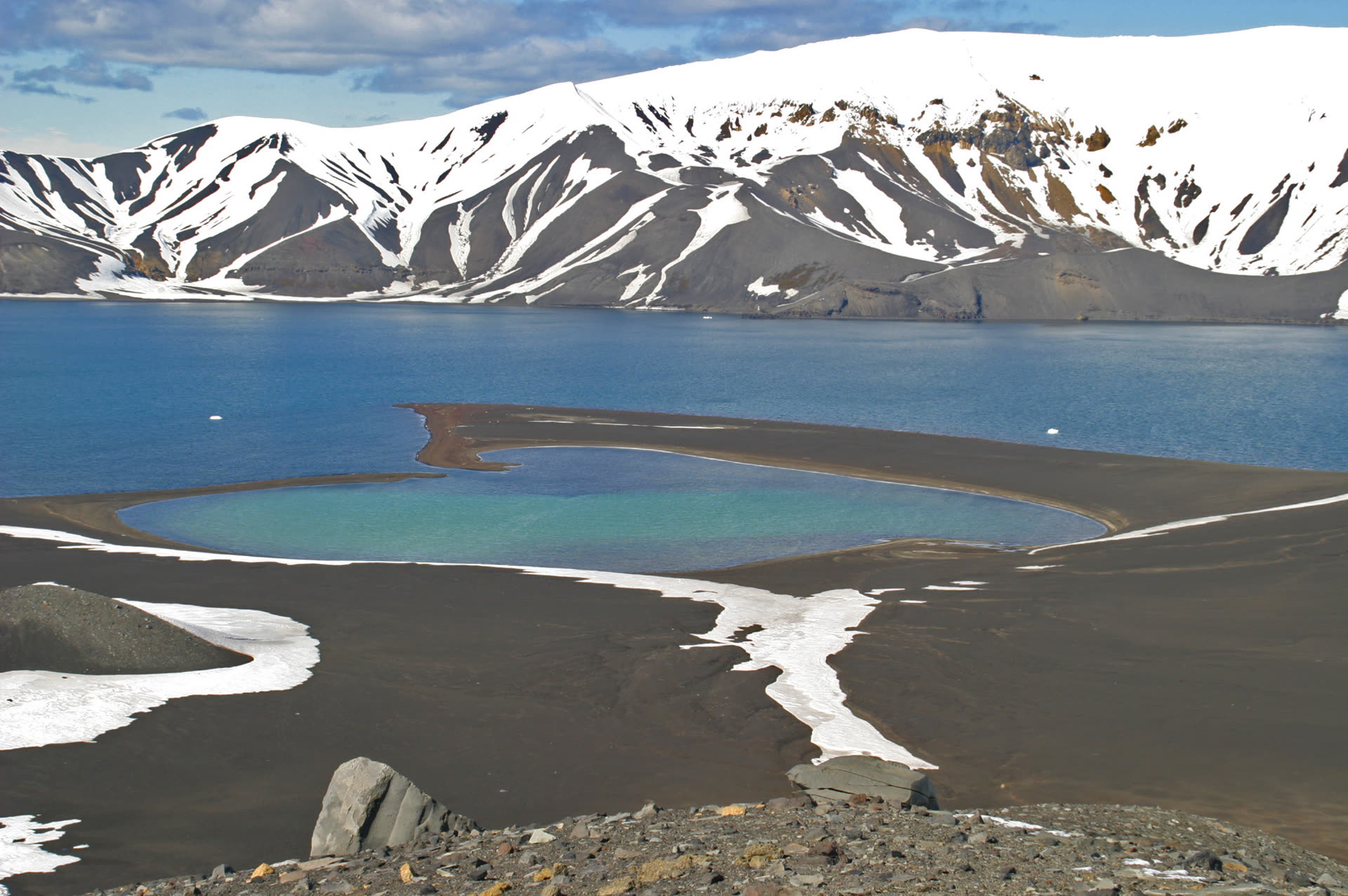 Aerial view of Deception Island's volcanic caldera, South Shetland Islands, Antarctica, showing the secondary crater formed by the island's 1970 eruption
