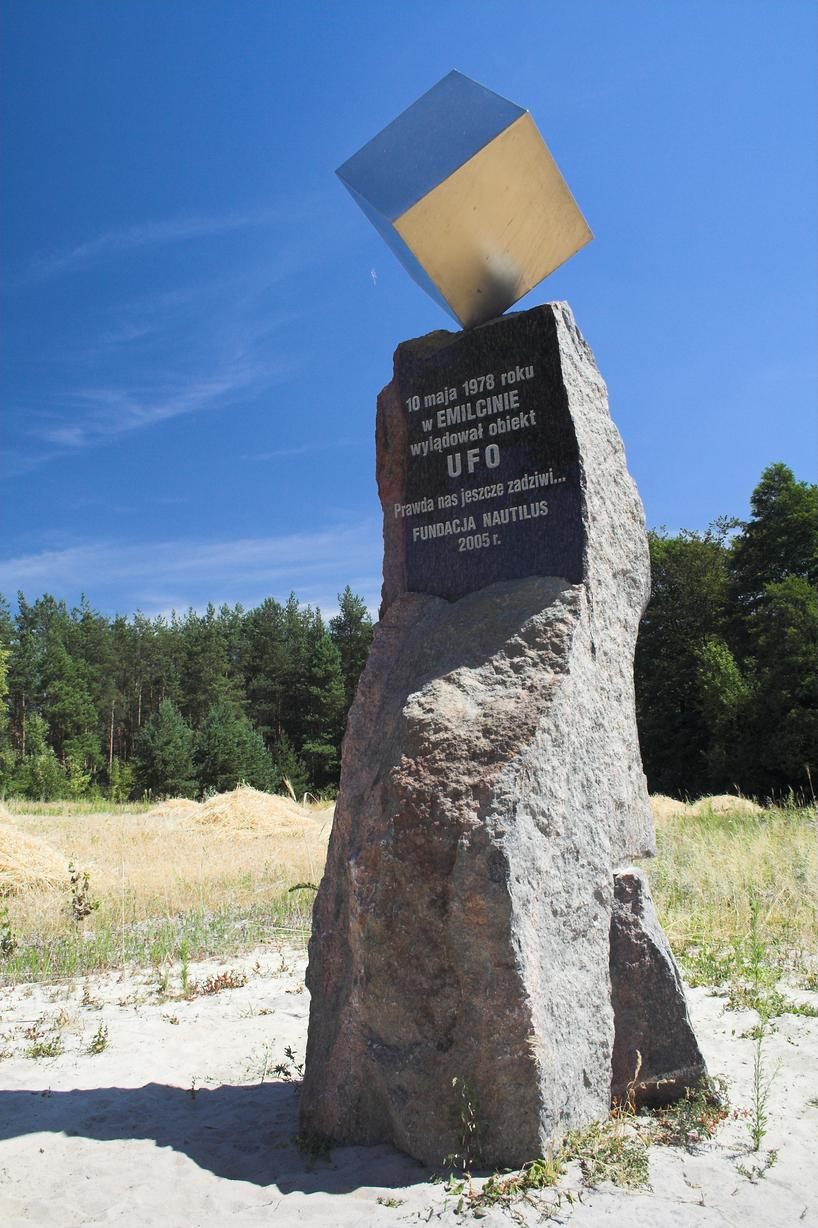 The UFO memorial near Emilcin, Poland — a stone obelisk with a suspended metal cube, erected in 2005 to commemorate Jan Wolski's 1978 encounter