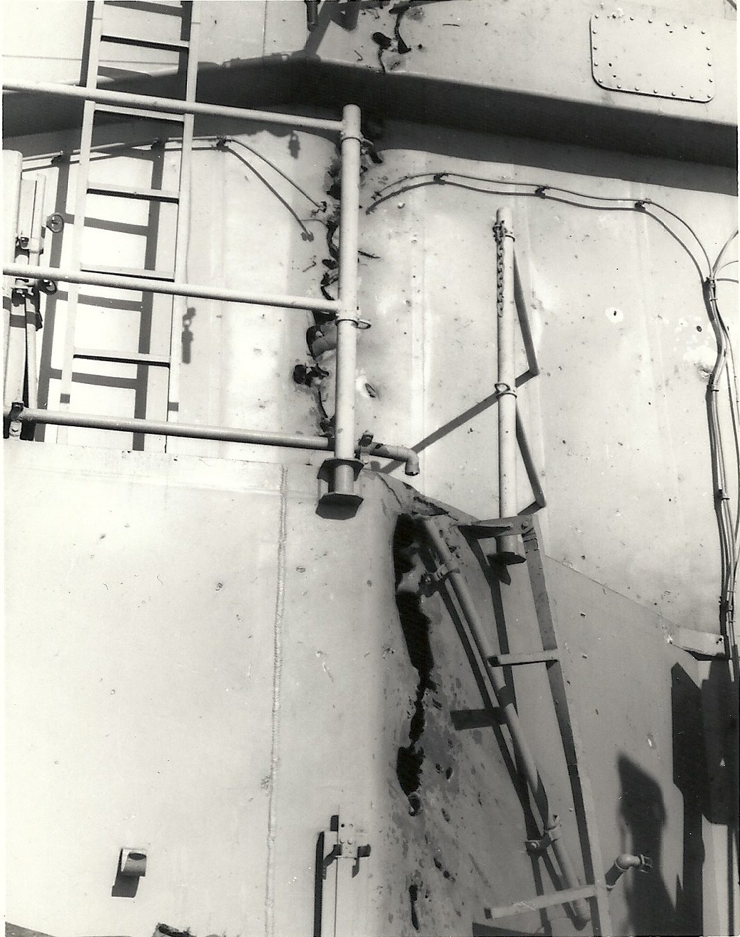 Genuine battle-damage photograph taken aboard HMAS Hobart on 17 June 1968, showing rod-warhead cutting damage to the ship's superstructure amidships