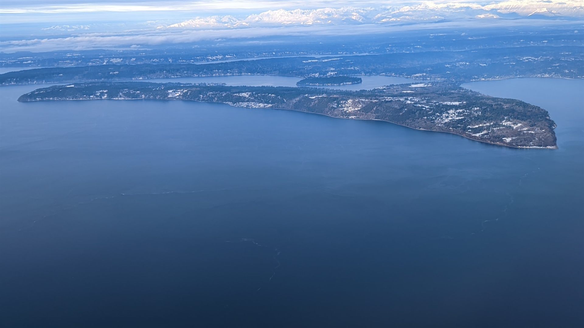 Maury Island in Puget Sound, Washington, looking west toward Vashon Island and the Burton peninsula — the real location central to the 1947 incident. This is a modern photograph of the island itself, not documentation of the alleged sighting.