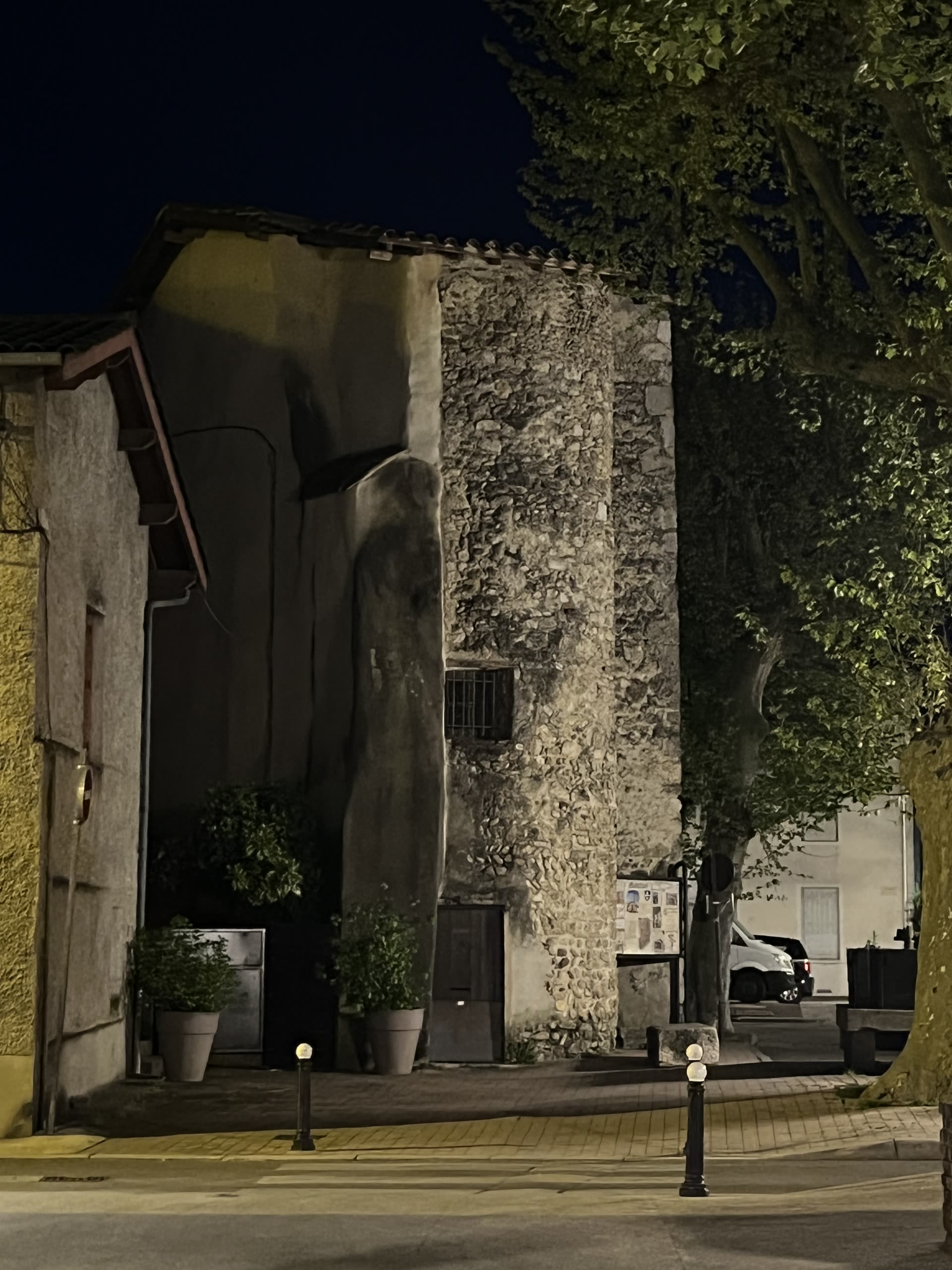 The Tour carree, a 14th-century tower in Montluel, Ain, France, photographed at night in April 2022