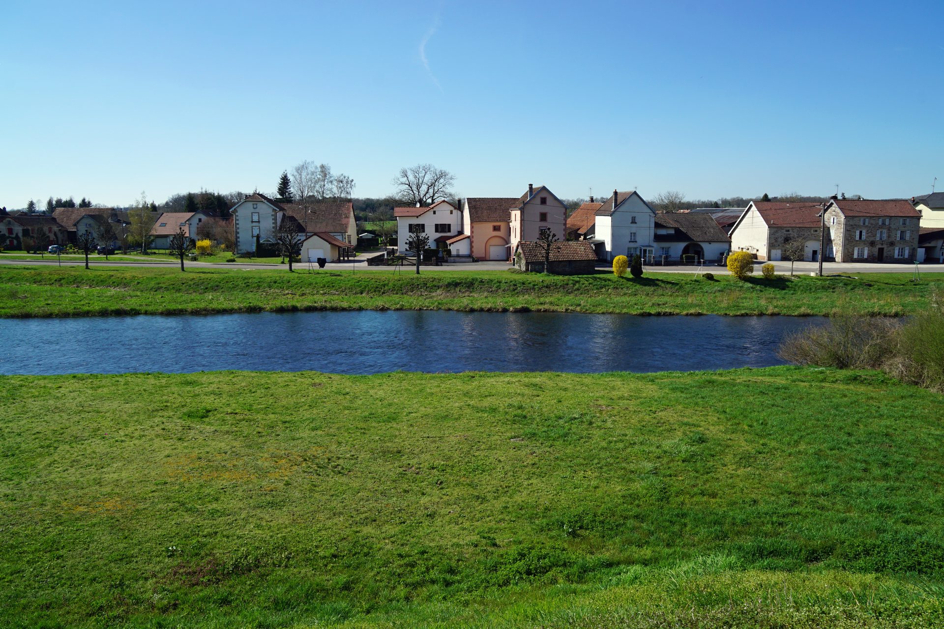 Houses along the Ognon river in La Neuvelle-lès-Lure, Haute-Saône, France