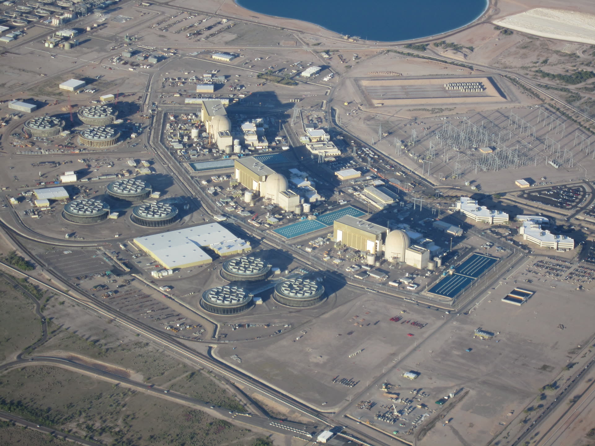 Aerial view of the Palo Verde Nuclear Generating Station near Wintersburg, Arizona, showing its cooling towers and reactor domes in the Sonoran Desert