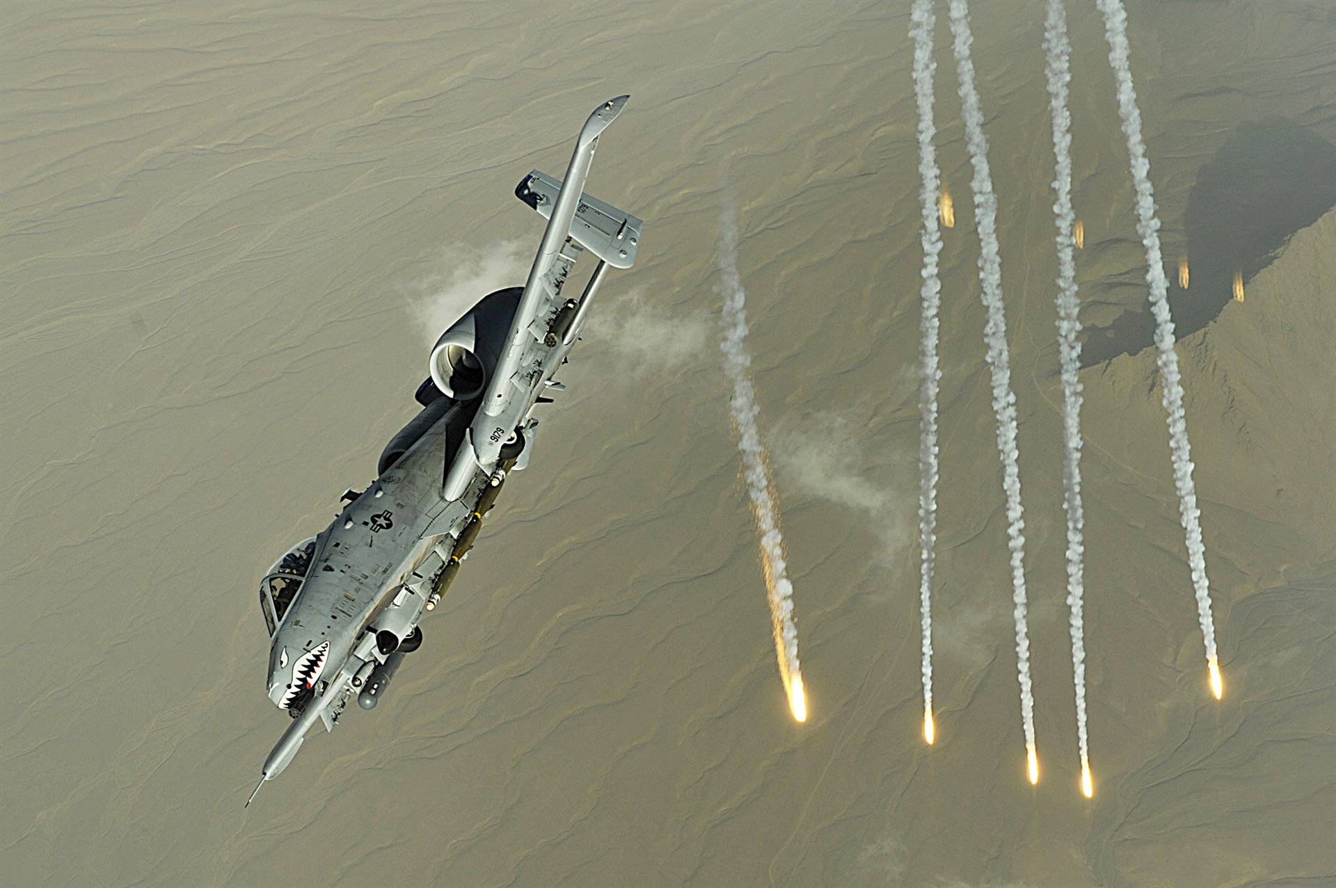 A U.S. Air Force A-10 Thunderbolt II deploying illumination flares — the same aircraft and ordnance type the Maryland Air National Guard's 104th Fighter Squadron used at the Barry M. Goldwater Range on March 13, 1997, officially cited as the source of the Phoenix Lights' second, stationary light event