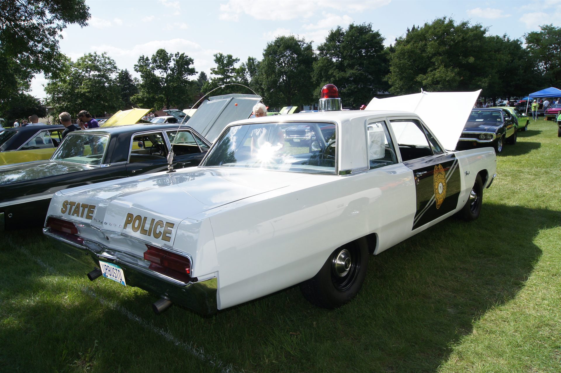 A 1967 Plymouth Fury I police cruiser in period-correct markings — the same general class of pursuit vehicle Portage County, Ohio sheriff's deputies would have driven during the April 1966 chase. This is not a photograph of the actual case; no public-domain image of the incident, the deputies' cruiser P-13, or the object itself is known to exist.