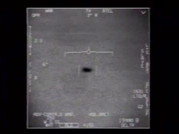 FLIR still frame from the declassified November 14, 2004 Nimitz encounter video (FLIR1), showing the oblong 'Tic Tac' object tracked by the F/A-18's targeting pod
